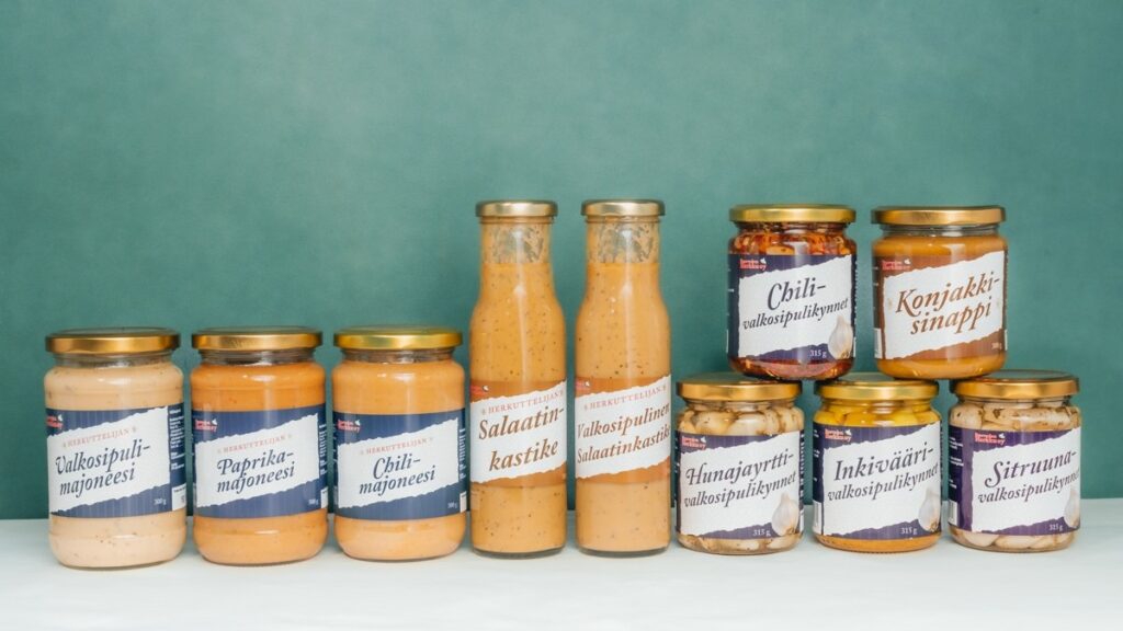 Jars of mustard, garlic, salad dressings, and mayonnaise.
