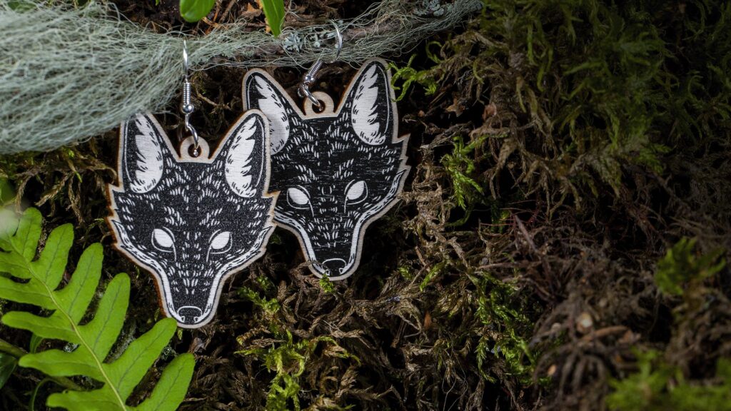Ideabutiikki’s wooden wolf earrings.
